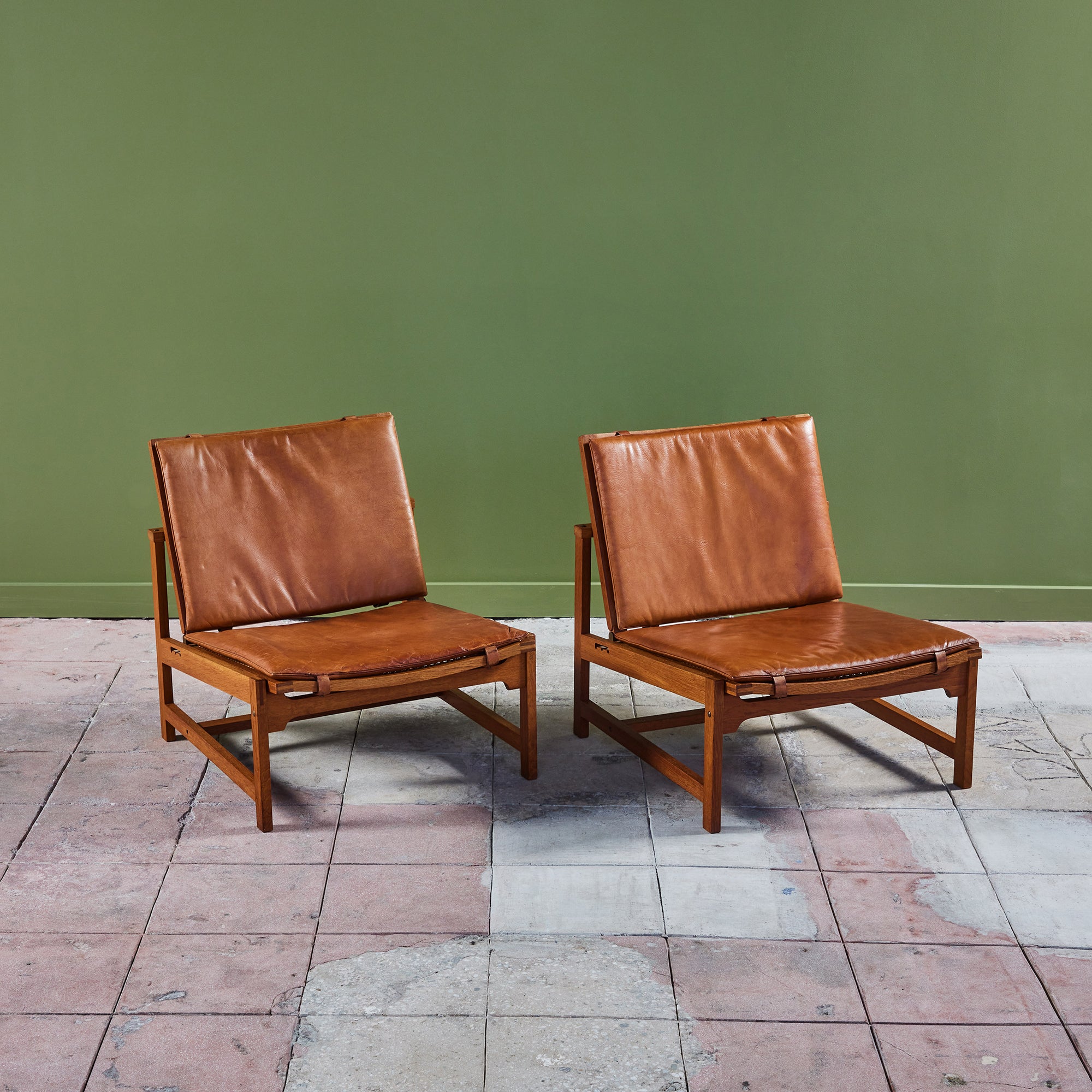 Pair of Arne Karlsen and Peter Hjort Leather and Cane Lounge Chairs