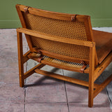 Pair of Arne Karlsen and Peter Hjort Leather and Cane Lounge Chairs