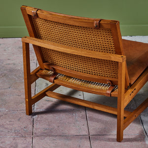 Pair of Arne Karlsen and Peter Hjort Leather and Cane Lounge Chairs