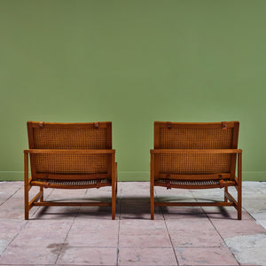 Pair of Arne Karlsen and Peter Hjort Leather and Cane Lounge Chairs