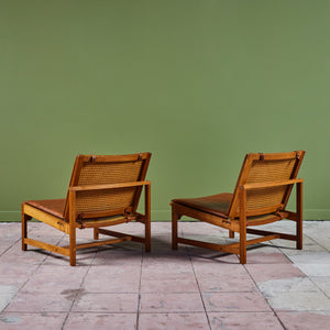 Pair of Arne Karlsen and Peter Hjort Leather and Cane Lounge Chairs