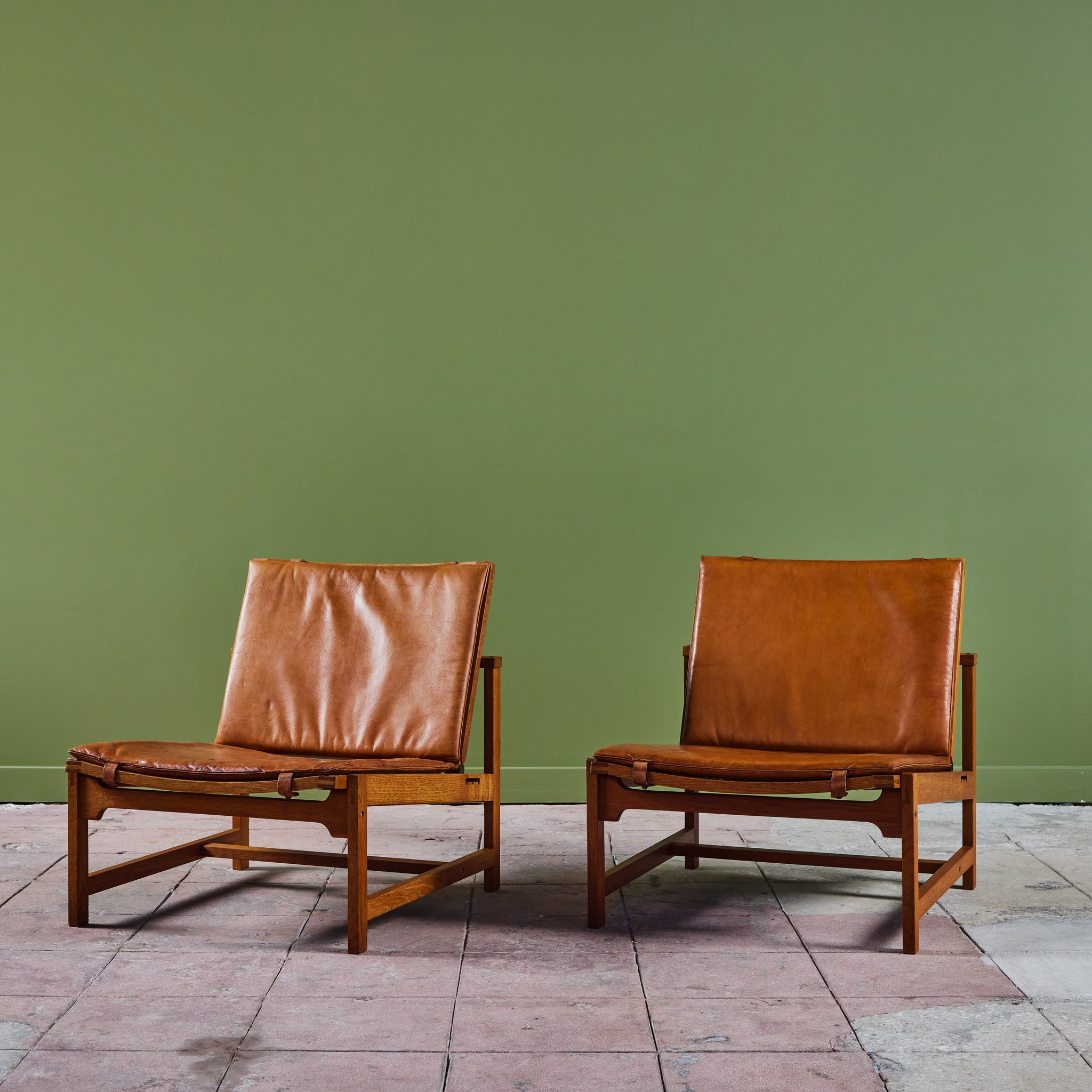 Pair of Arne Karlsen and Peter Hjort Leather and Cane Lounge Chairs