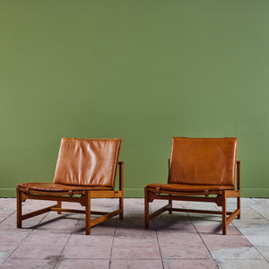 Pair of Arne Karlsen and Peter Hjort Leather and Cane Lounge Chairs