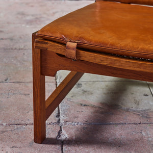Pair of Arne Karlsen and Peter Hjort Leather and Cane Lounge Chairs