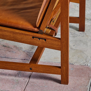 Pair of Arne Karlsen and Peter Hjort Leather and Cane Lounge Chairs