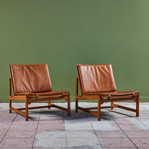 ON HOLD ** Pair of Arne Karlsen and Peter Hjort Leather and Cane Lounge Chairs
