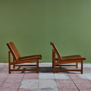 Pair of Arne Karlsen and Peter Hjort Leather and Cane Lounge Chairs