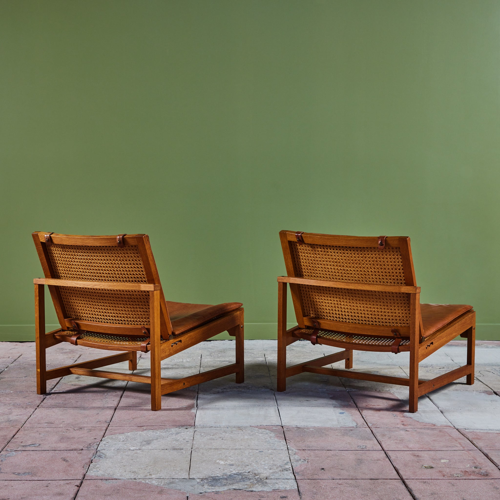 Pair of Arne Karlsen and Peter Hjort Leather and Cane Lounge Chairs