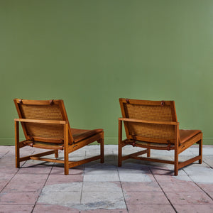 Pair of Arne Karlsen and Peter Hjort Leather and Cane Lounge Chairs