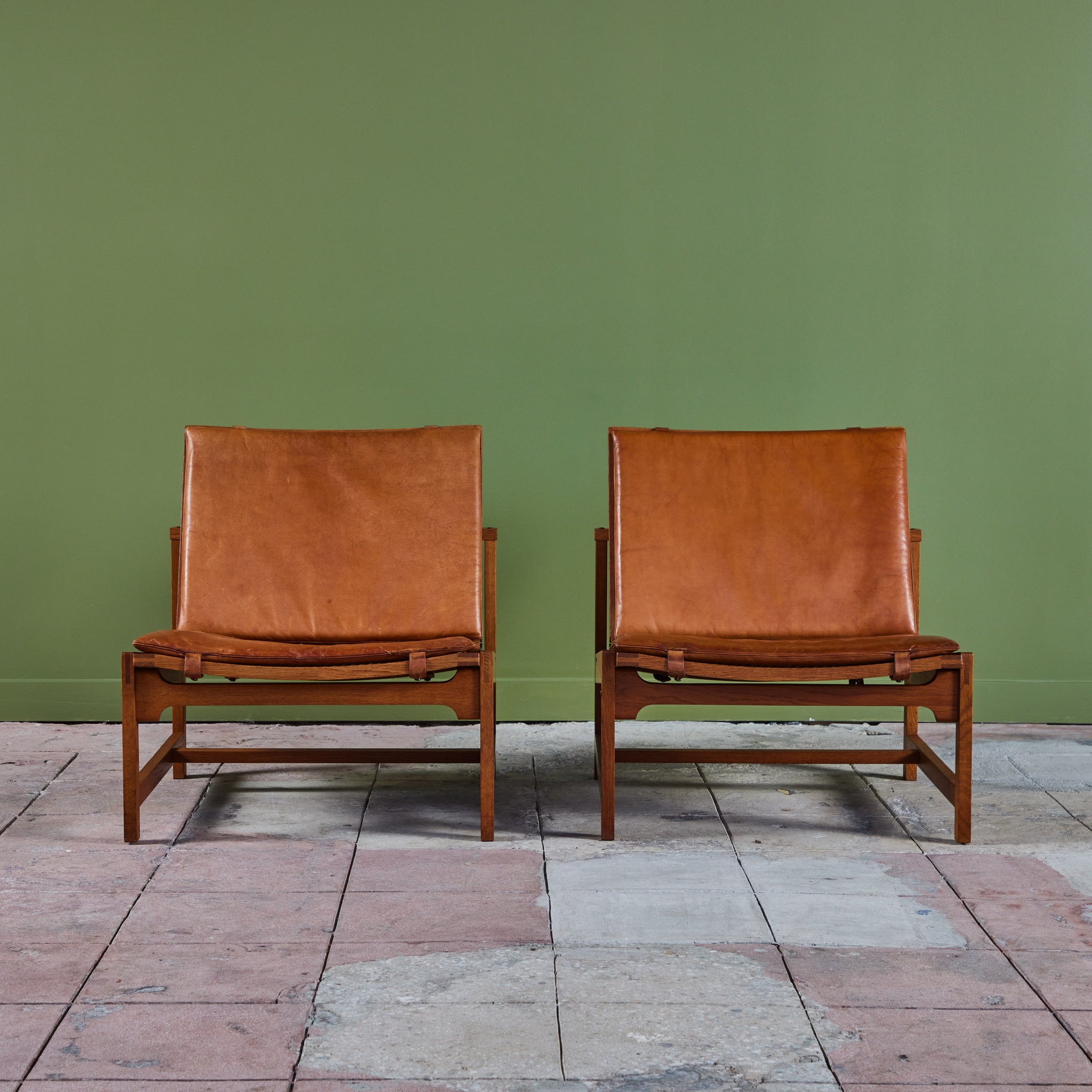 Pair of Arne Karlsen and Peter Hjort Leather and Cane Lounge Chairs
