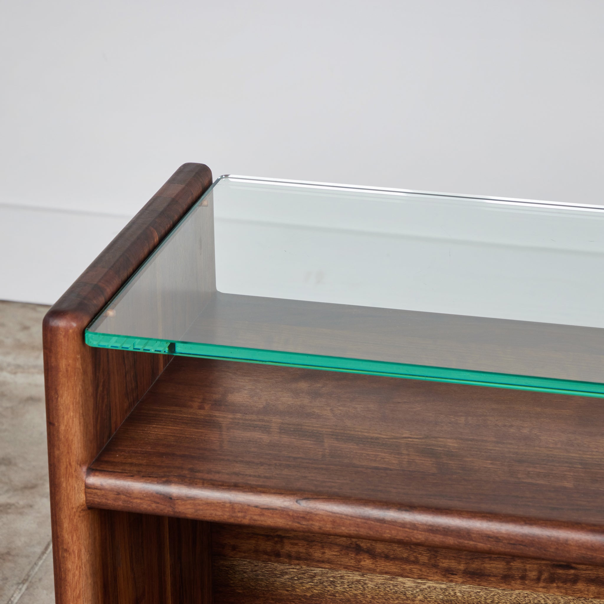 Gerald McCabe Console in Shedua with Glass Top