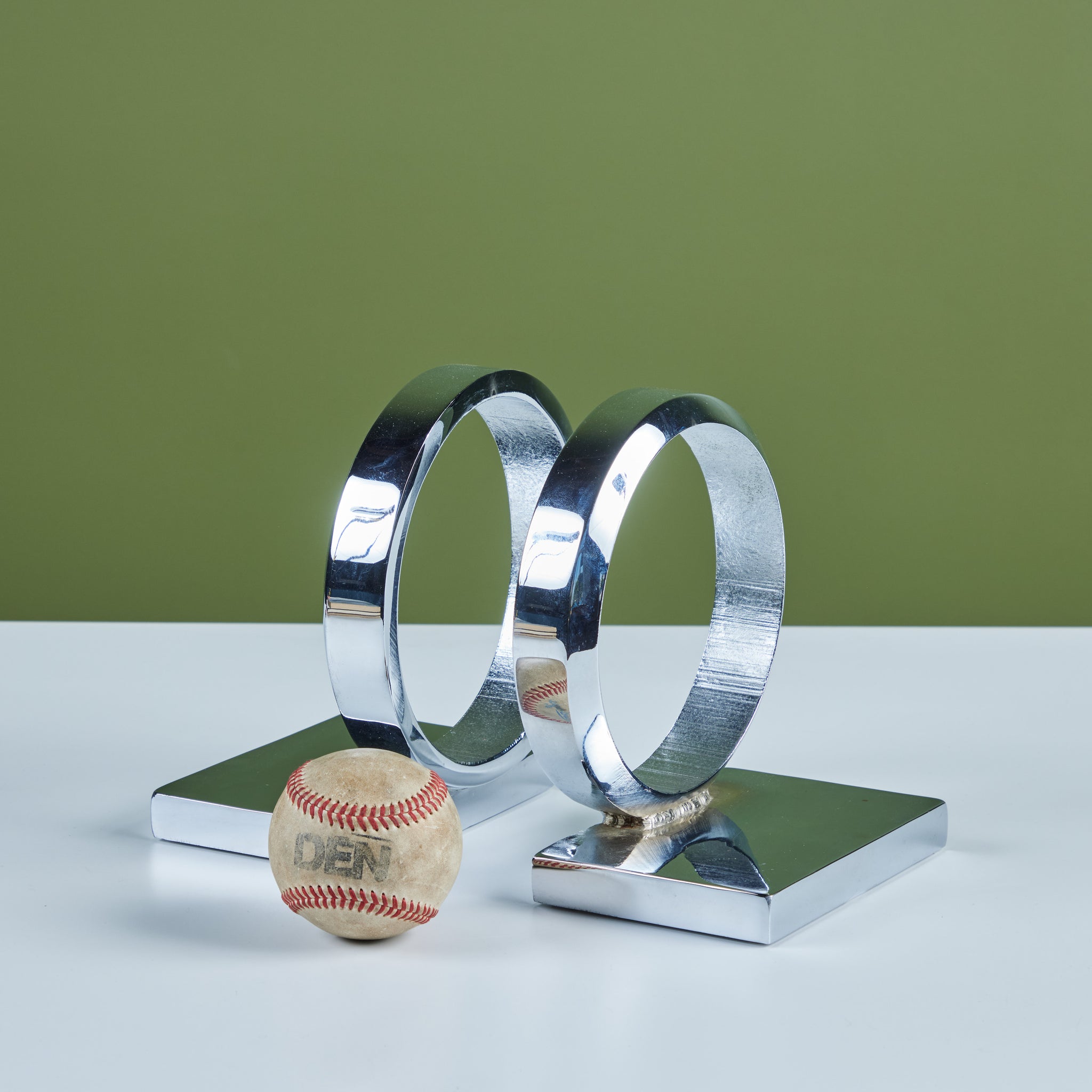 Circular Chrome Bookends in the Style of Curtis Jeré